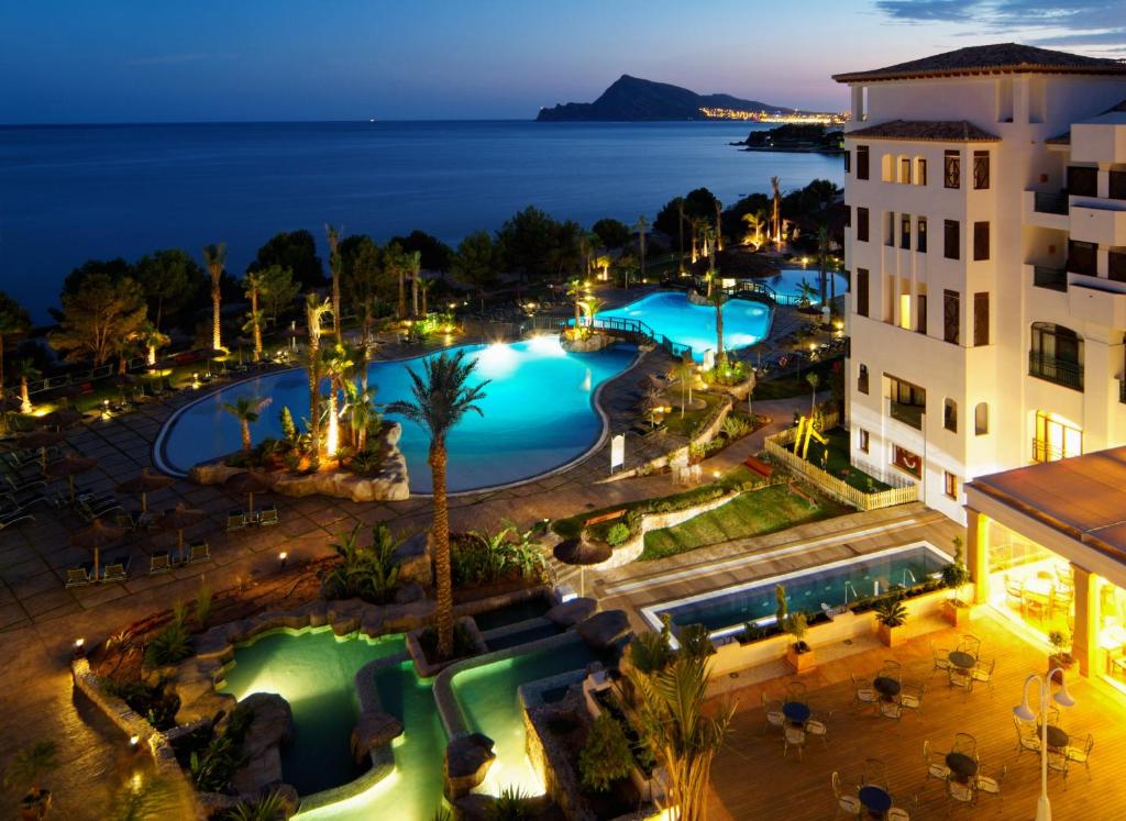 an aerial view of a hotel with a pool at night at SH Villa Gadea in Altea