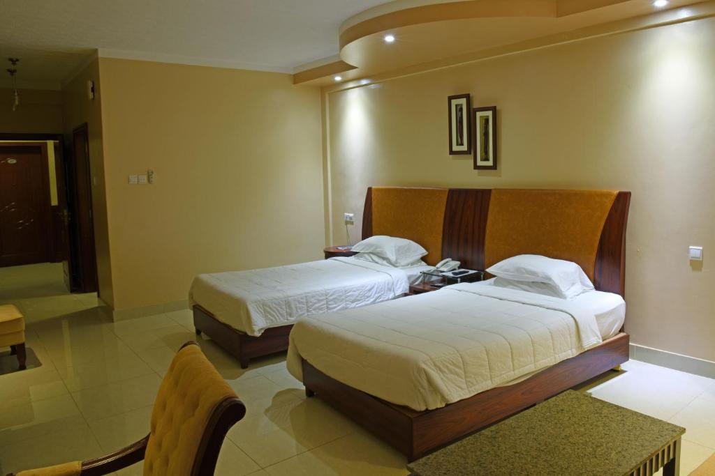 Imperial Golf View Hotel tesisinde bir odada yatak veya yataklar
