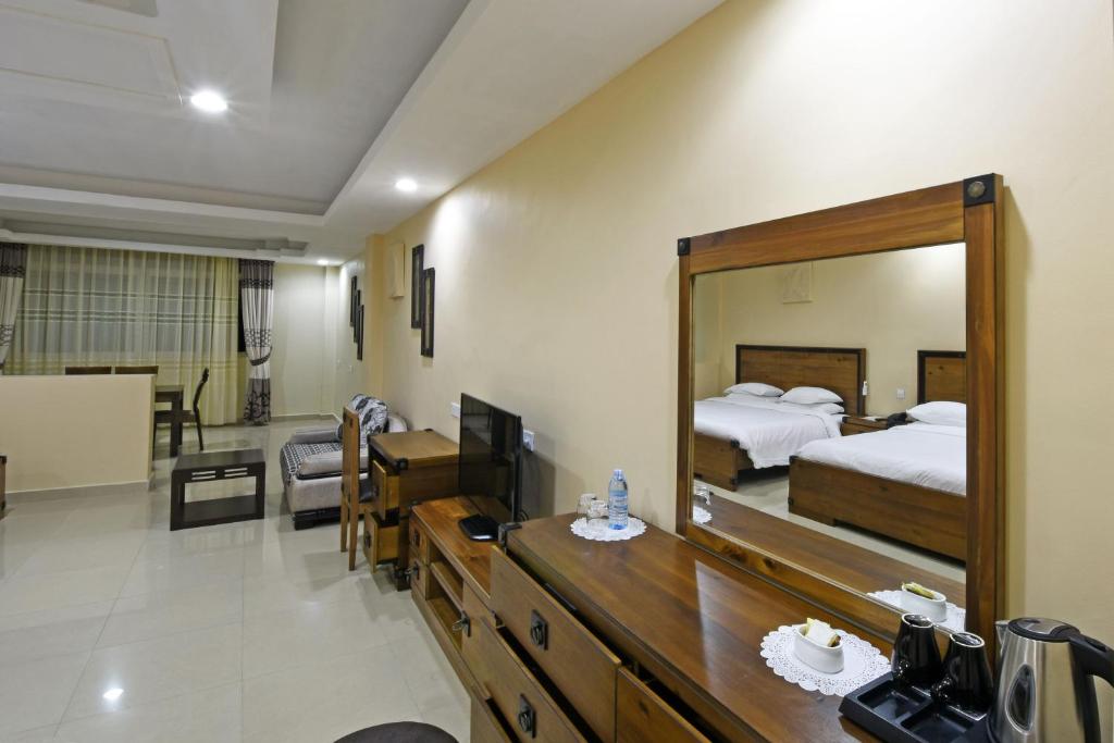 Imperial Golf View Hotel tesisinde bir odada yatak veya yataklar