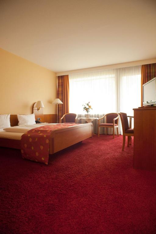 Postel nebo postele na pokoji v ubytování Hotel Kloster Hirsau
