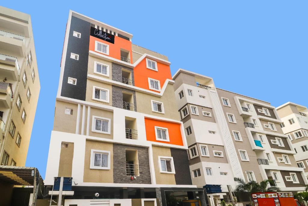 an apartment building with an orange at Super Collection O Rio Kondapur Near Rahavendra Colony in Hyderabad
