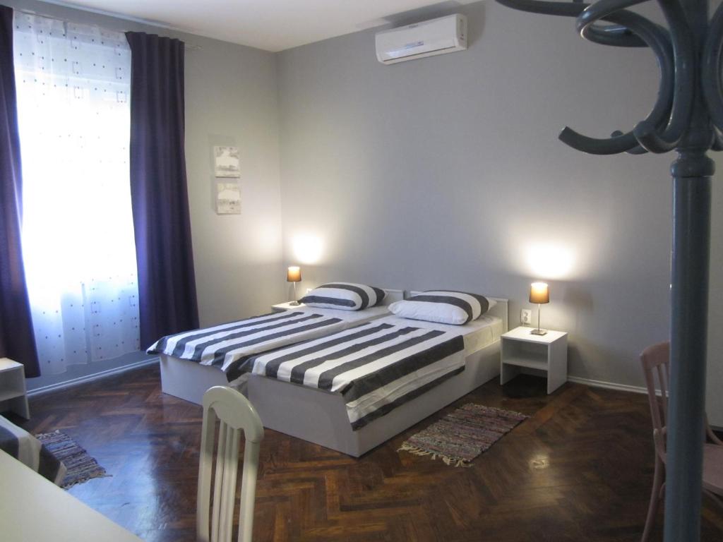 Postel nebo postele na pokoji v ubytování Guest House Ilona