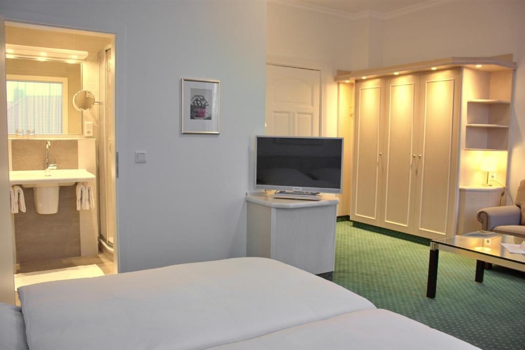 Postel nebo postele na pokoji v ubytování Hotel Westfalenhof