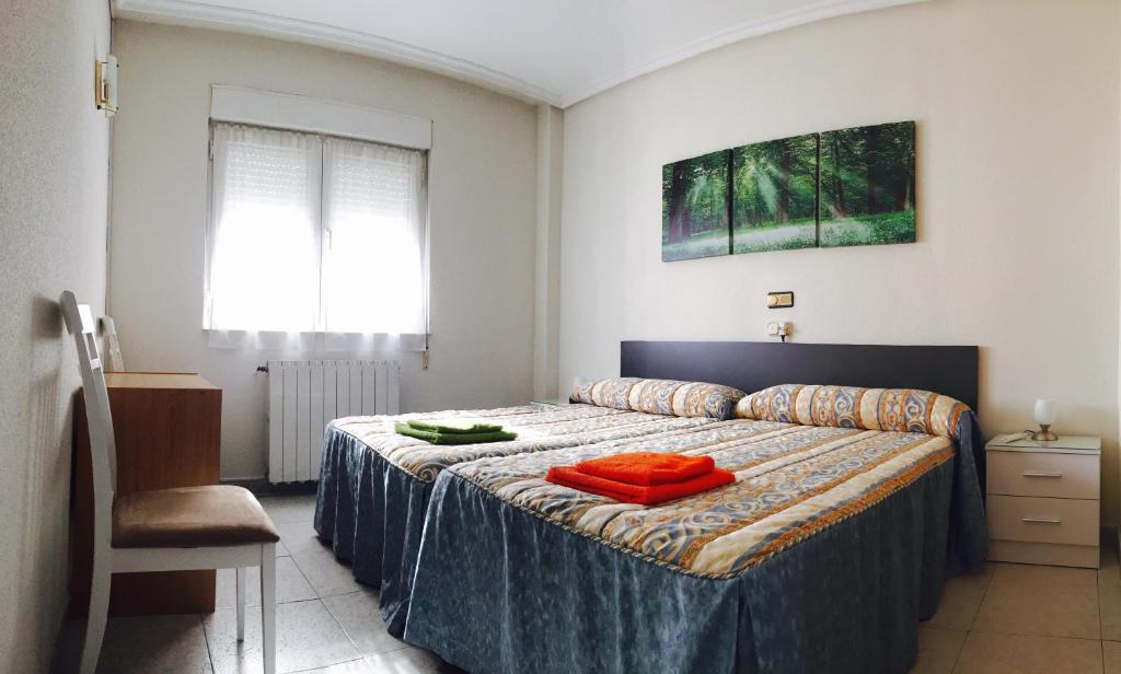 Postel nebo postele na pokoji v ubytování Hostal Sol Naciente