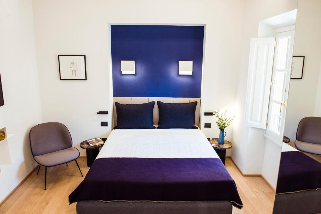 Postel nebo postele na pokoji v ubytování Hotel Milu Florence