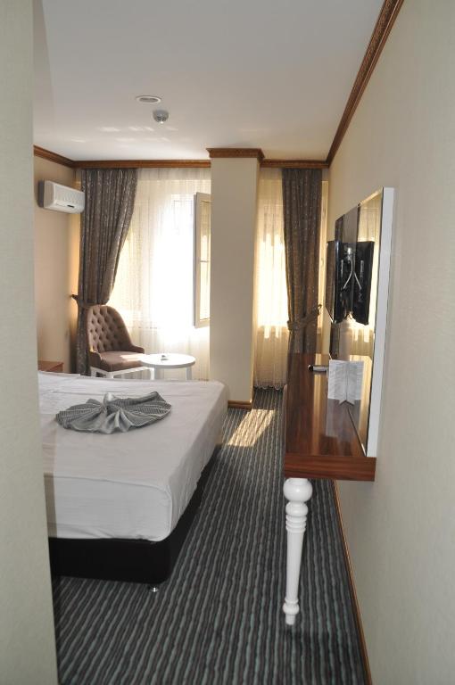 Postel nebo postele na pokoji v ubytování Grand Sera Hotel
