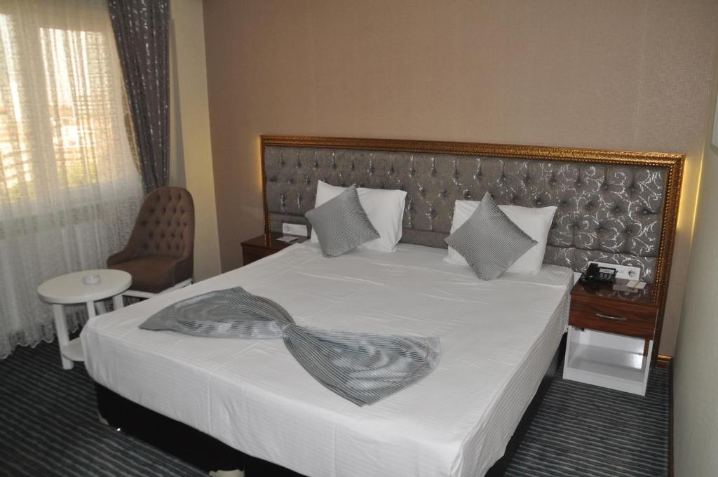 Postel nebo postele na pokoji v ubytování Grand Sera Hotel