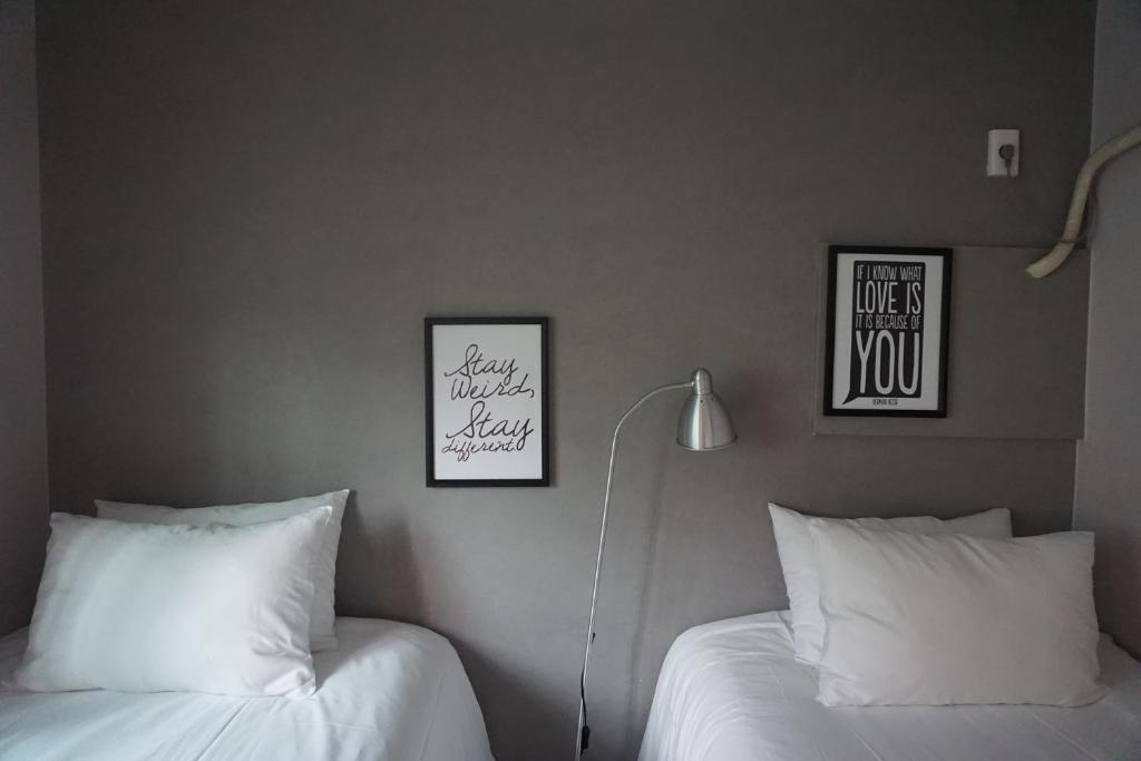 Postel nebo postele na pokoji v ubytování Grim Garden Guesthouse