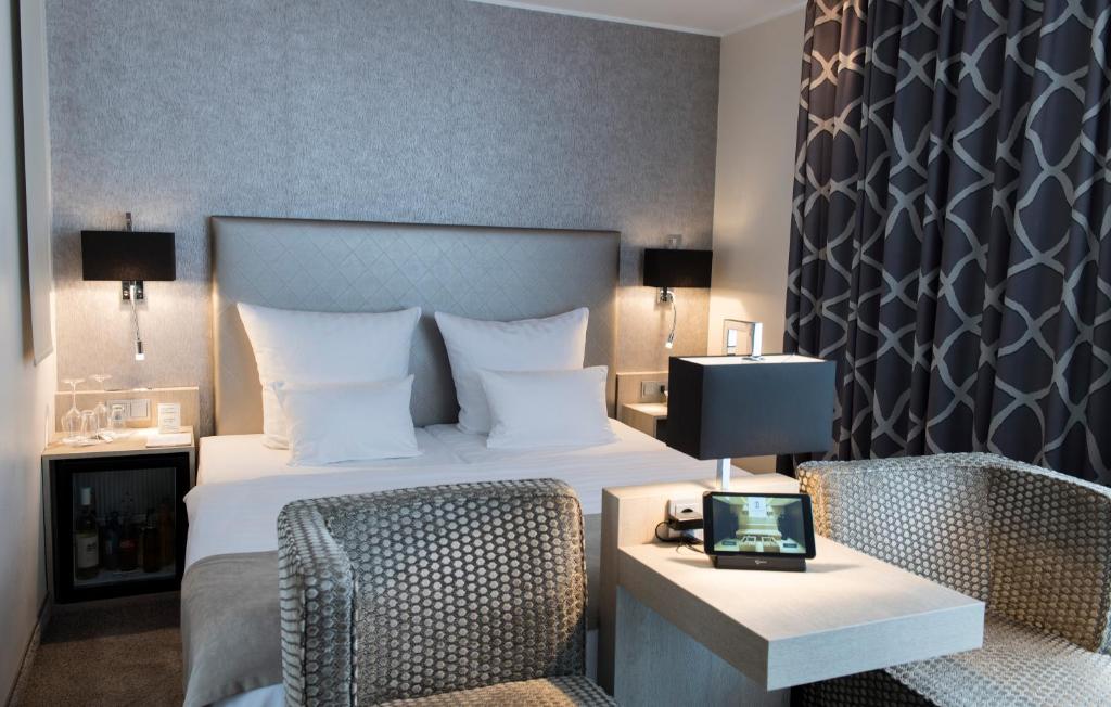 Postel nebo postele na pokoji v ubytování Thomas Hotel Spa & Lifestyle