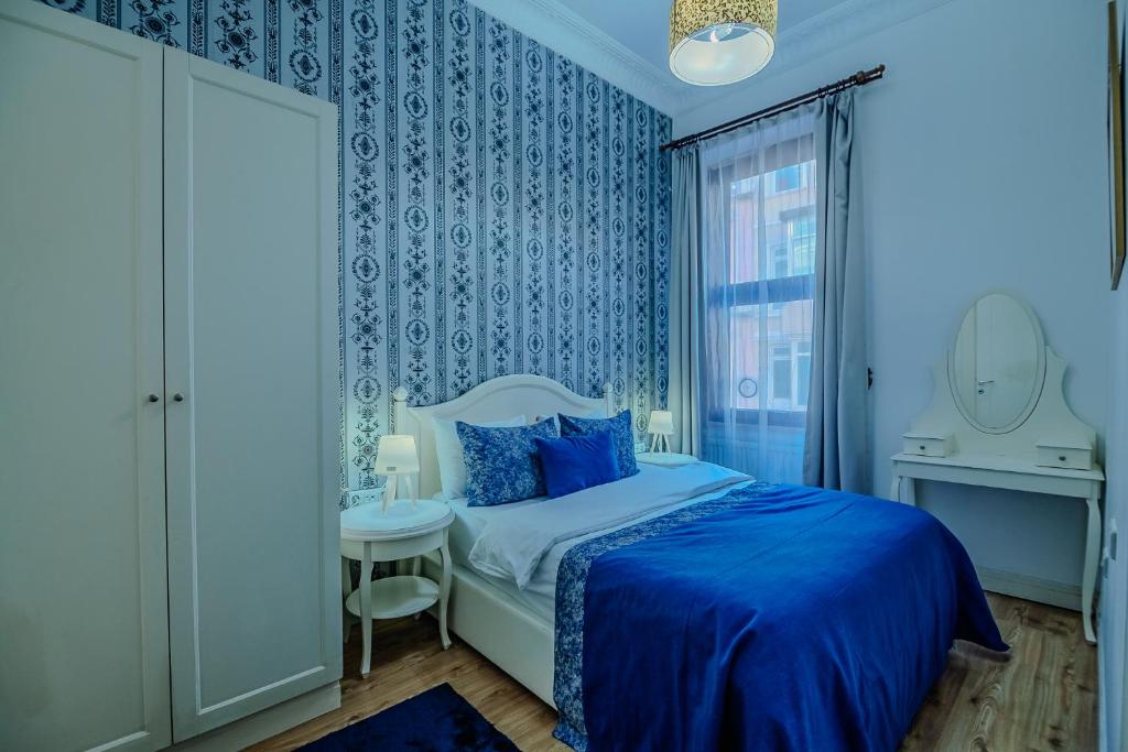 Postel nebo postele na pokoji v ubytování Taksim inci Apartment