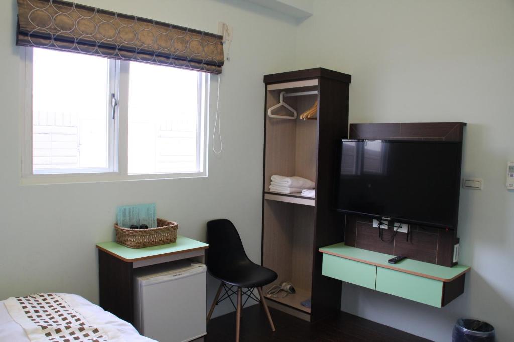 TV a/nebo společenská místnost v ubytování Magi House