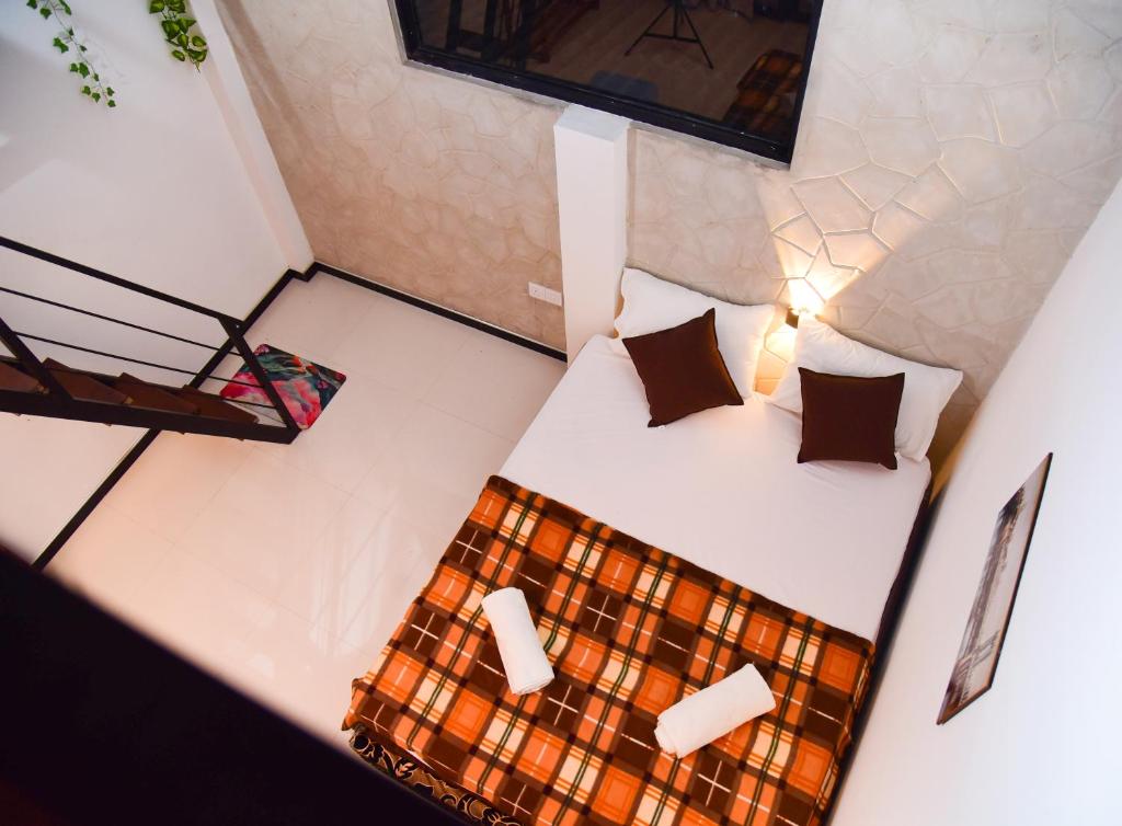 Giường trong phòng chung tại Mountain Breeze Villa