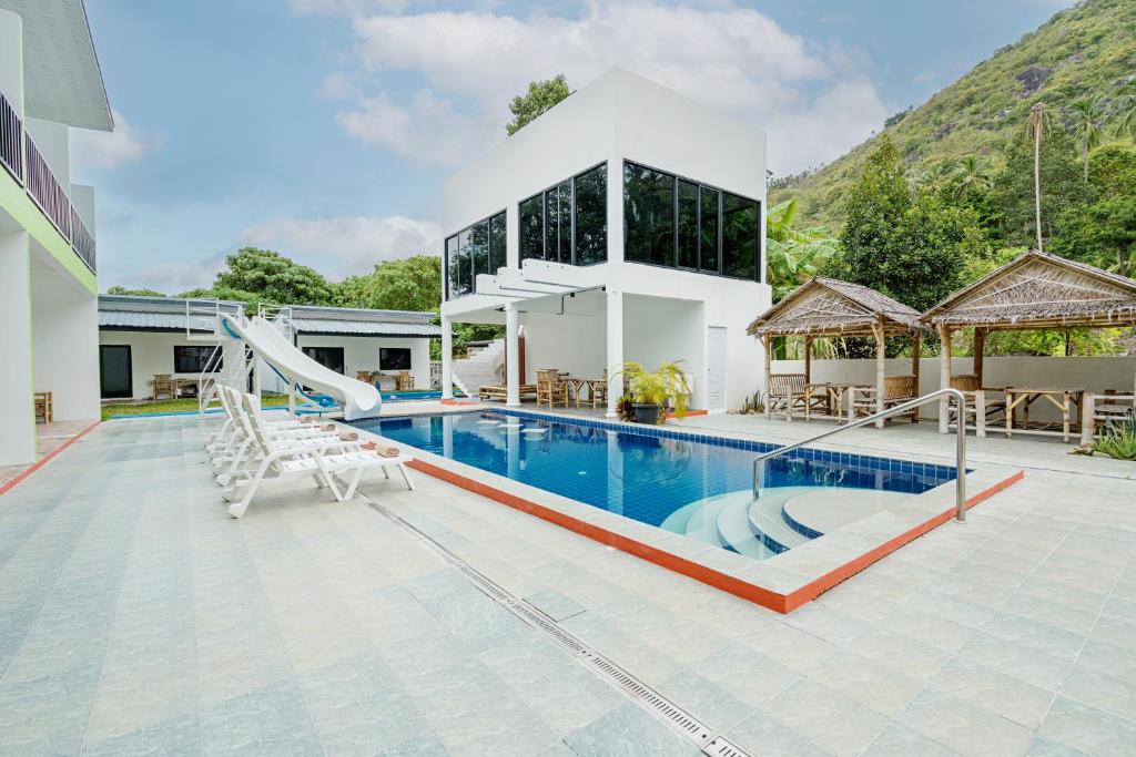 a villa with a swimming pool and a slide at Samui Hills Resort in Amphoe Koh Samui