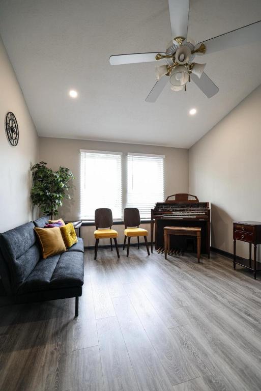 a living room with a couch and a piano at The Coffee House in Lexington