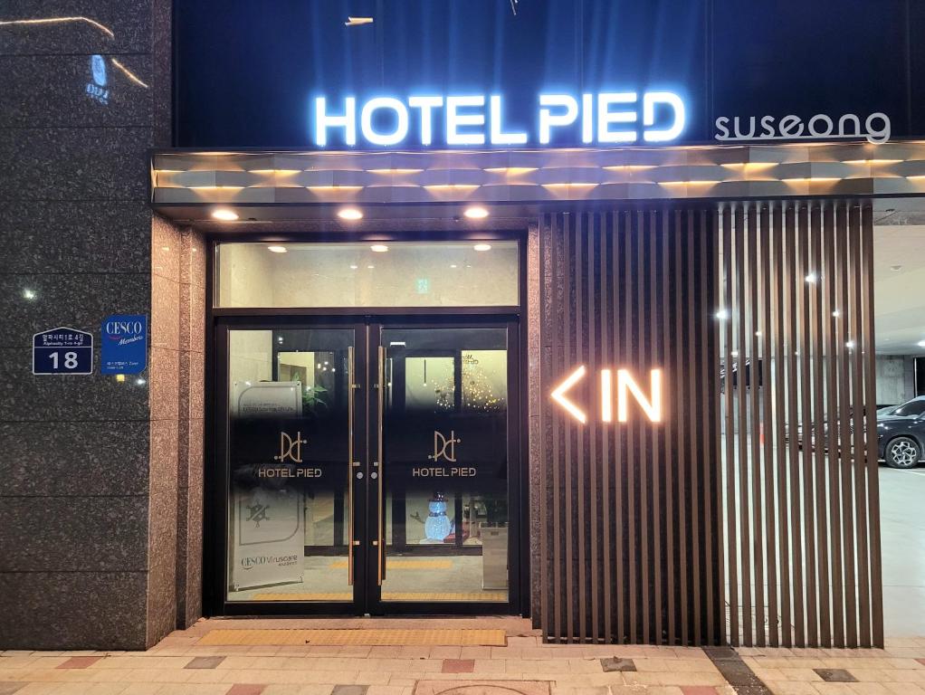a hotel fired sign on the front of a building at Hotel PIED Suseong in Daegu