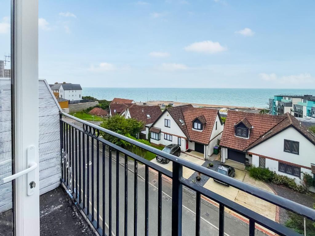 a view of the ocean from the balcony of a house at Oasis in Hythe
