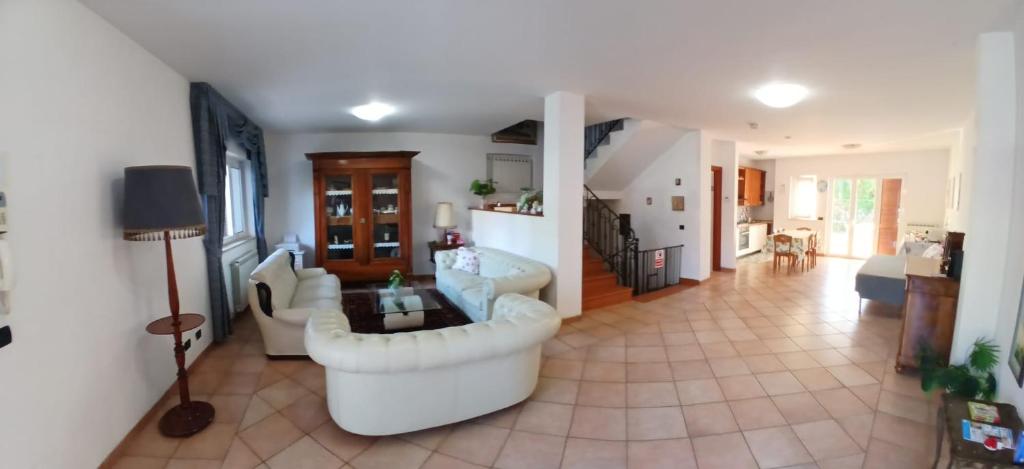 a living room with a couch and a table at La casa di ale in Latina