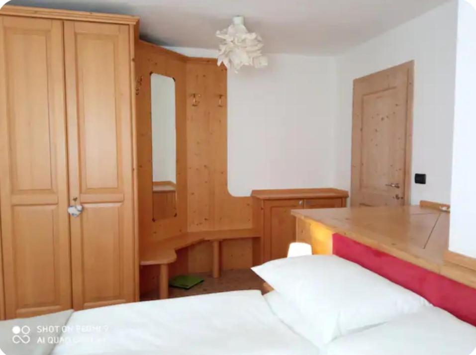 Una cama o camas en una habitación de Appartamento Daiano