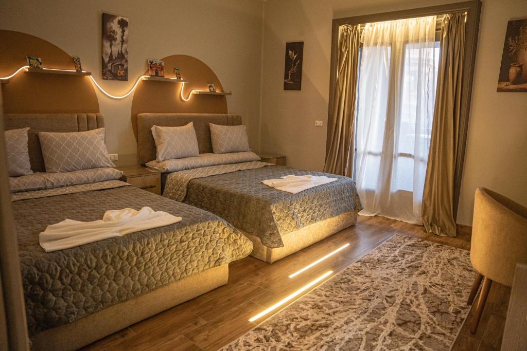 Ένα ή περισσότερα κρεβάτια σε δωμάτιο στο Central Stay Suites