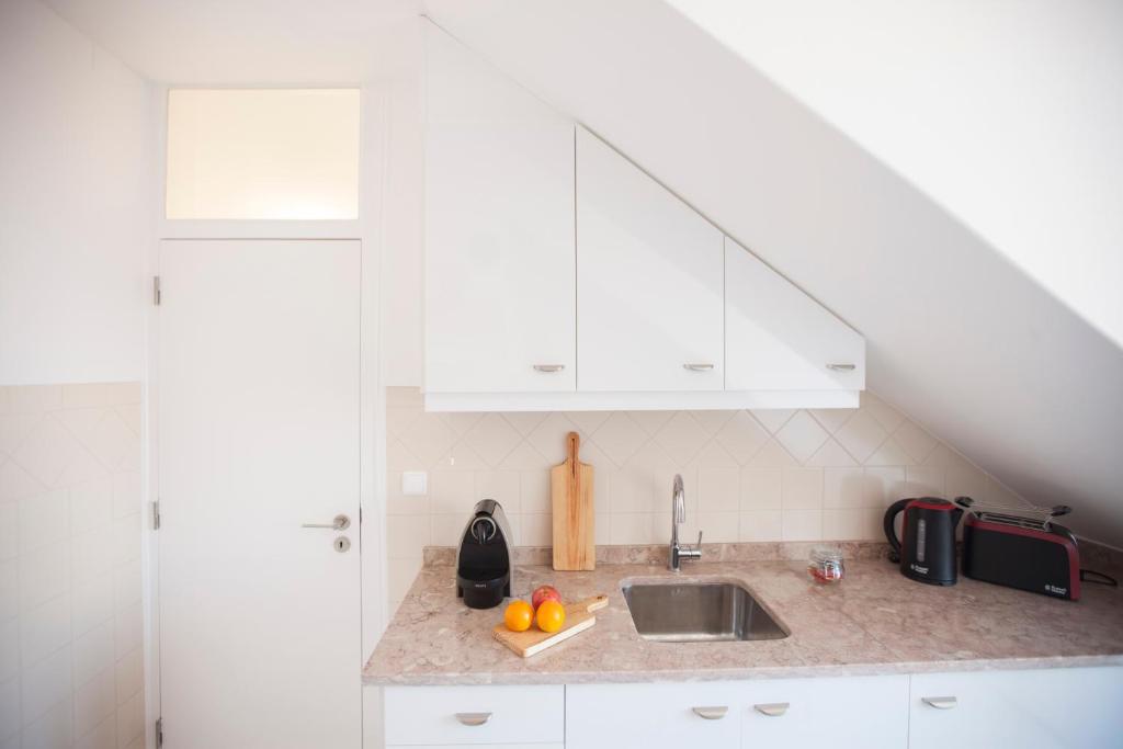 Kuchyň nebo kuchyňský kout v ubytování Otília Apartamentos