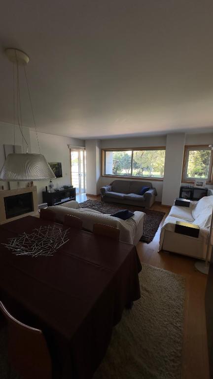 a large living room with couches and a couch at Luxury apartment in Espinho