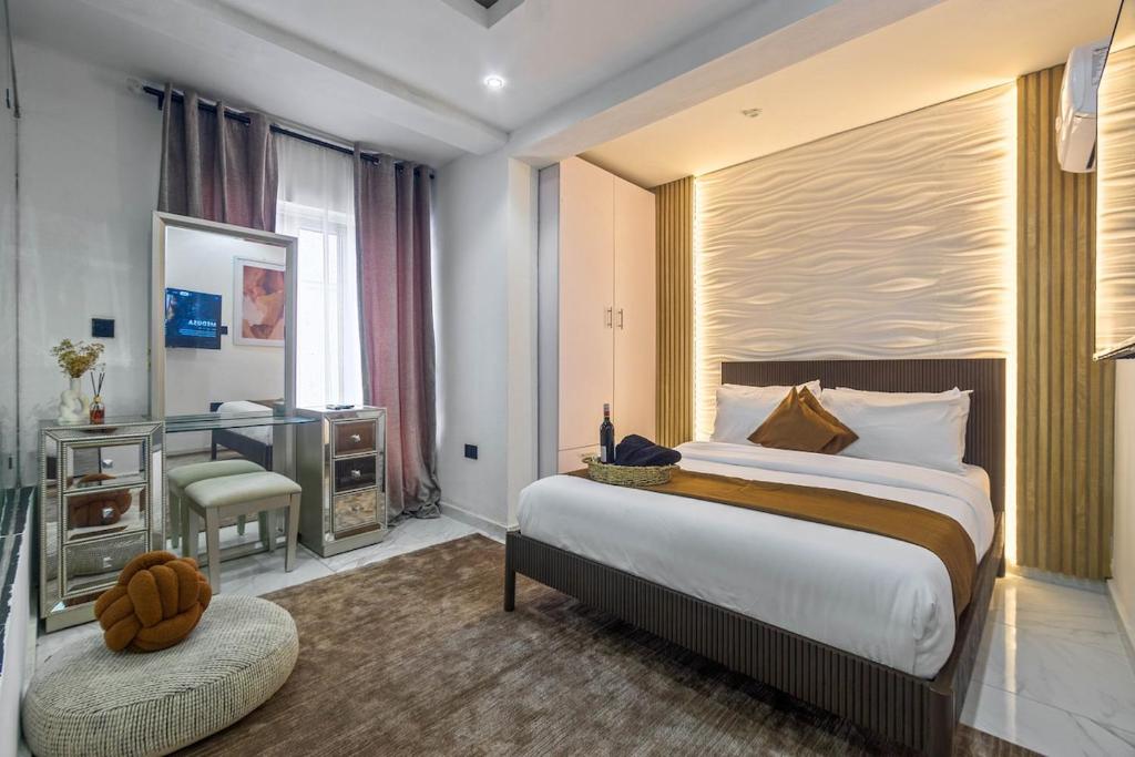 Ένα ή περισσότερα κρεβάτια σε δωμάτιο στο The Champagne Suite