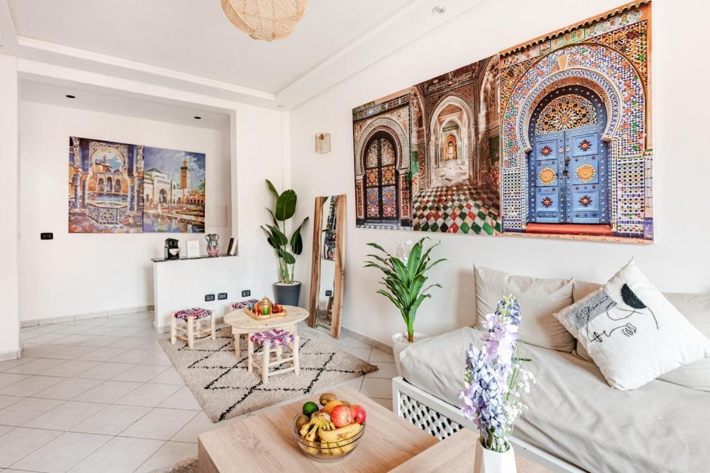 a living room with a couch and a table at Modern Elegance & Moroccan Charm - Gueliz Center in Marrakech