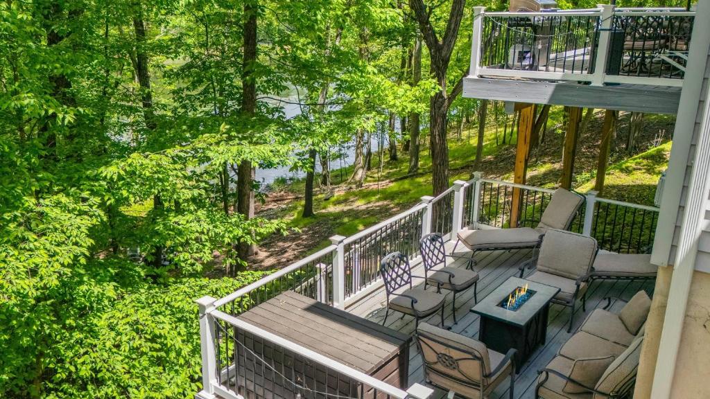 an aerial view of a porch with chairs and a table at Lakeview Retreat w Kayaks Game Room Firepits Gated Community w Lake Beach Access in East Stroudsburg