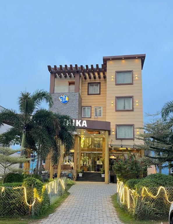 a hotel building with a walkway in front of it at HOTEL TAIKA in Rāmeswaram