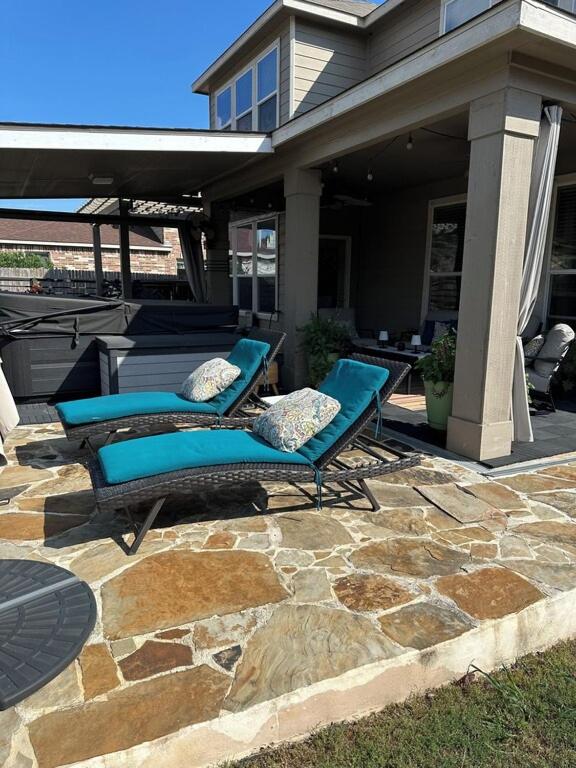 two blue lounge chairs on a stone patio at Relax with Spacious Modern Simplicity in Boerne