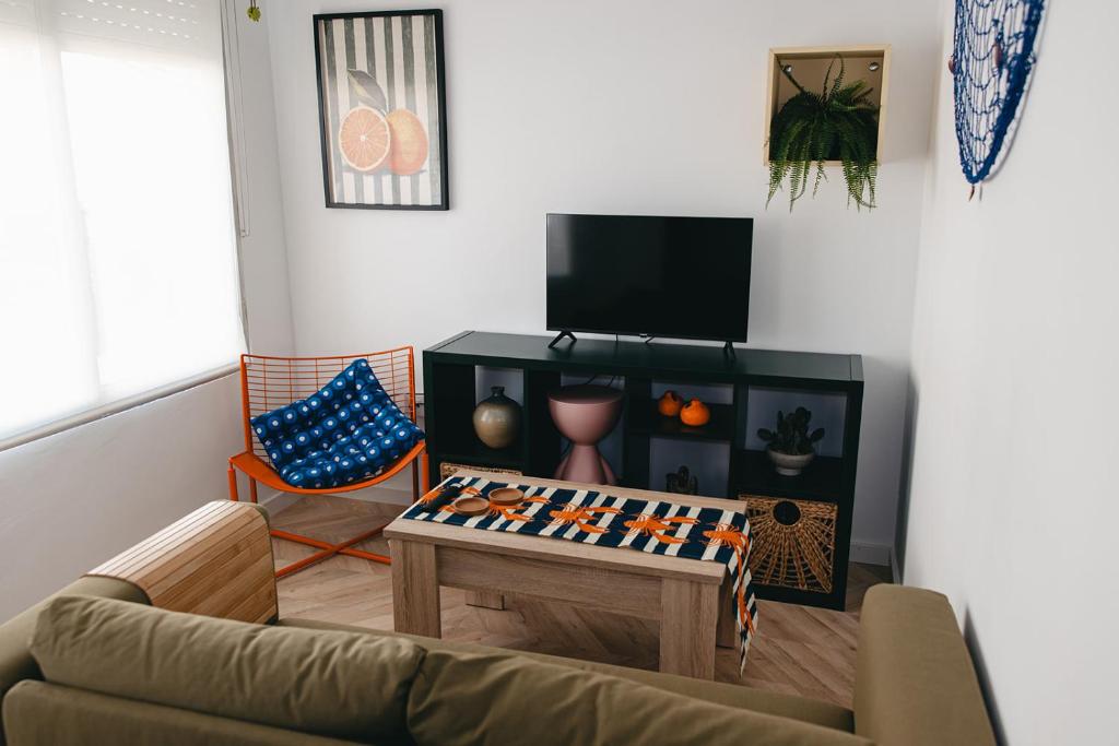 a living room with a couch and a table at Domus Mare in Peñíscola