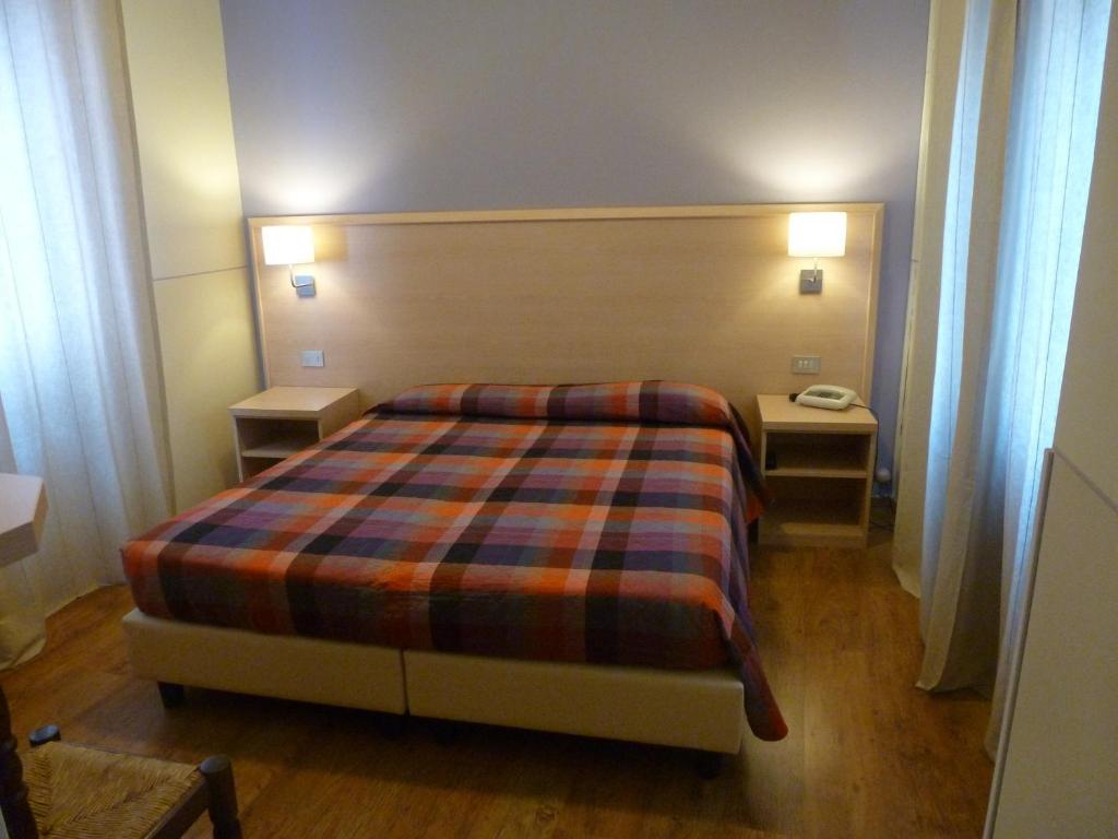 Postel nebo postele na pokoji v ubytování Hotel Da Cesare