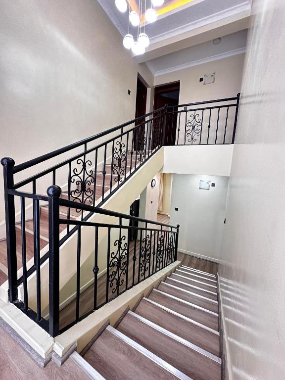 a spiral staircase in a building with a stair railing at Nanyuki House in Nanyuki