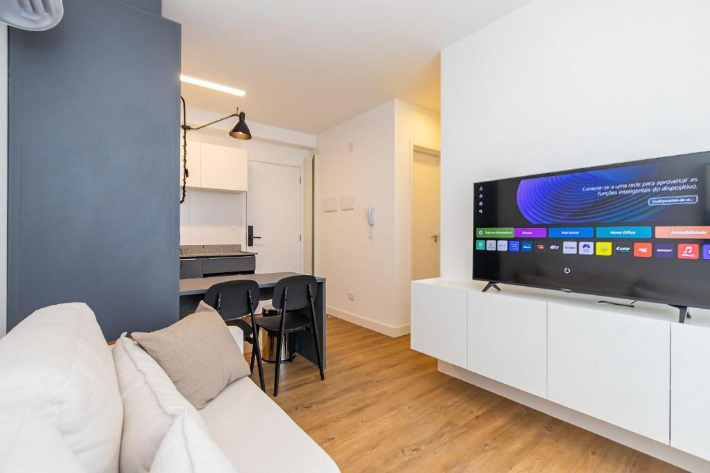 TV a/nebo společenská místnost v ubytování Apartamento de 2 Quartos com Garagem - IBI2309