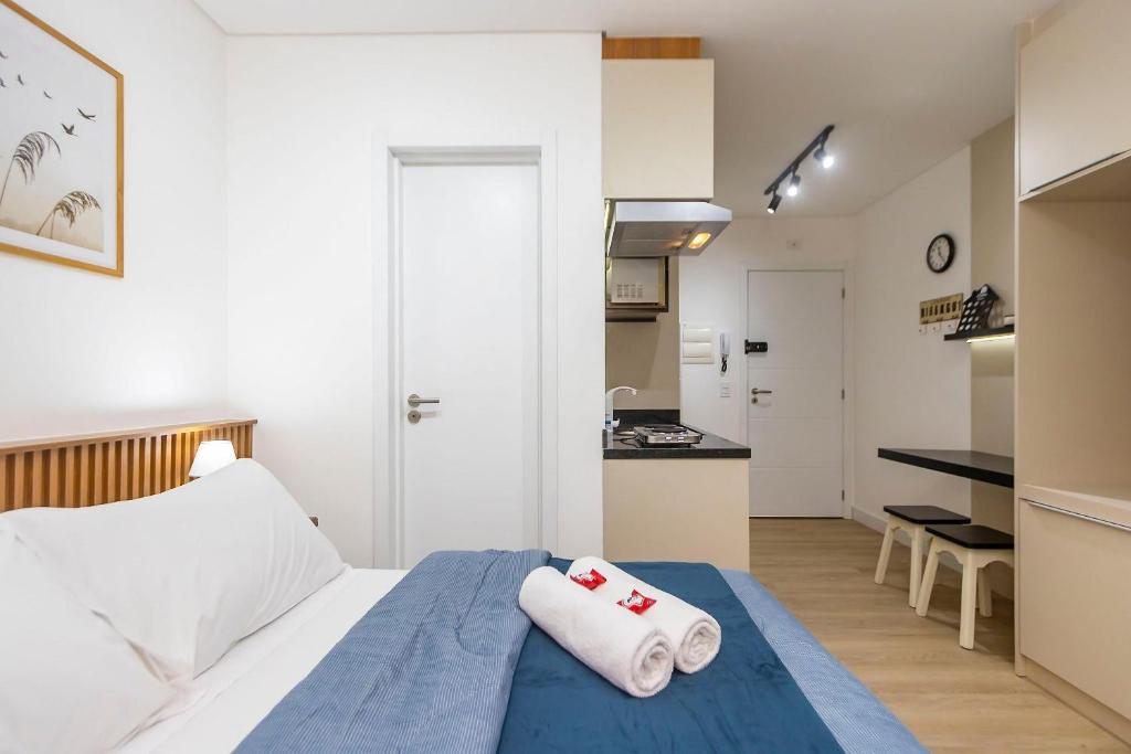 En eller flere senge i et værelse på Studio no LOG Centro de Curitiba - LOG0311