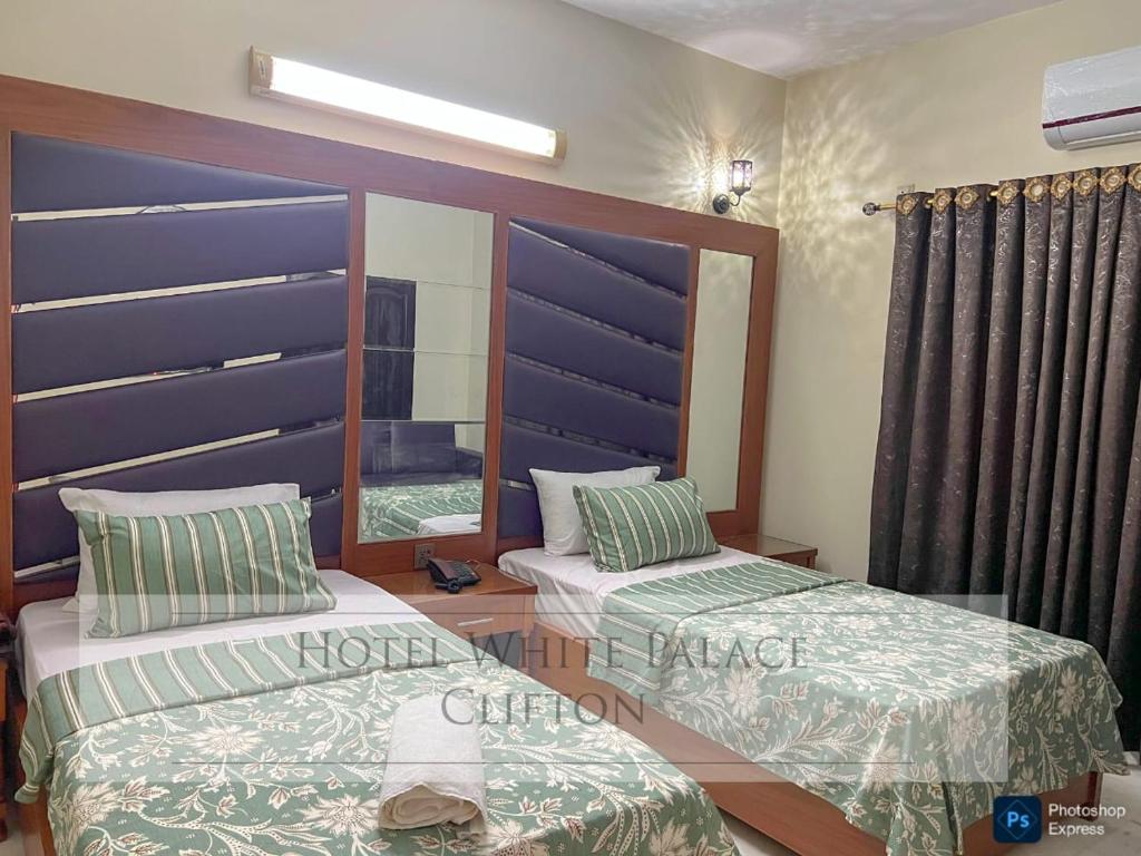 Ένα ή περισσότερα κρεβάτια σε δωμάτιο στο Hotel beachside