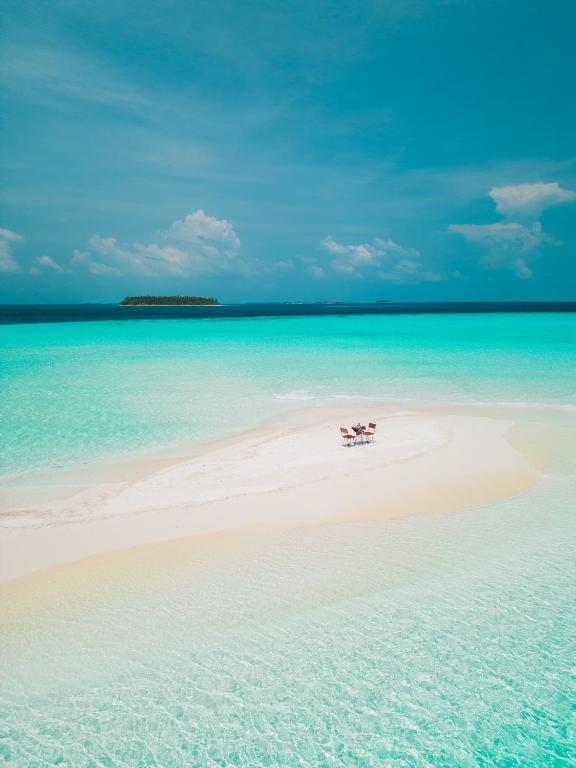 a small island in the middle of the ocean at Dhoani Maldives Boutique in Kendhoo