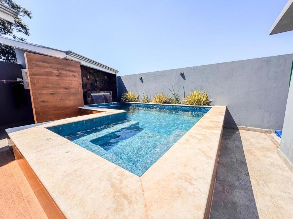 a swimming pool in the backyard of a house at Casa dos sonhos em Ribeirão Claro, PR in Ribeirão Claro