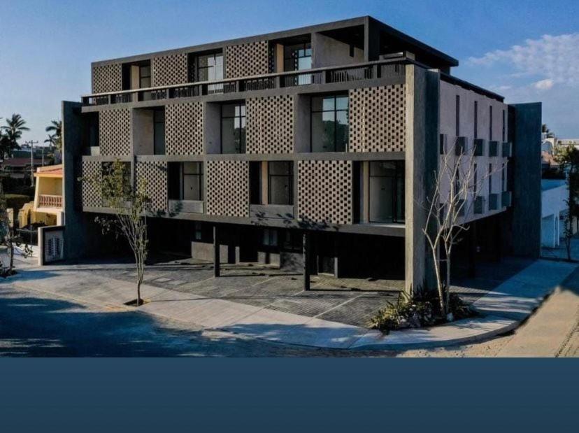a building with a lot of windows on it at A beautiful apartment, in the heart of the golden zone! in Mazatlán