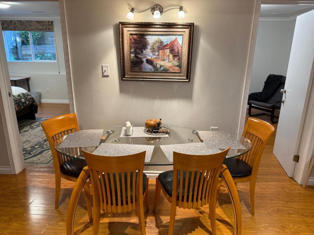 a dining room with a table and chairs at Place near the Coquitlam River Park in Coquitlam