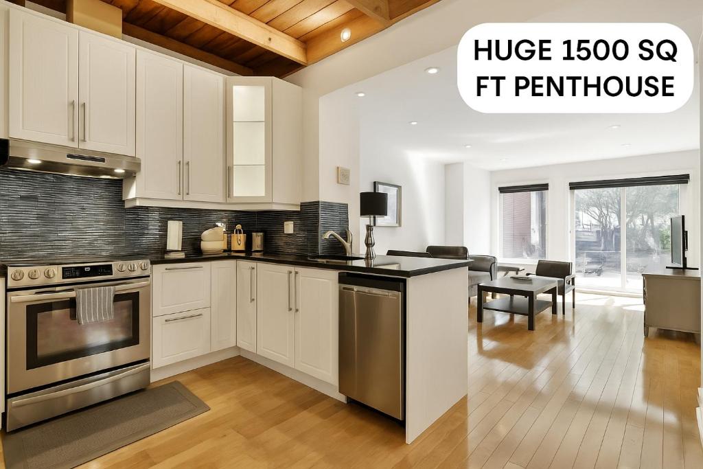 Hotel STUNNING full APARTMENTS - on the FAMOUS ST Denis street - Near METRO, a kitchen with white cabinets and a living room at STUNNING full APARTMENTS - on the FAMOUS ST Denis street - Near METRO in Montreal