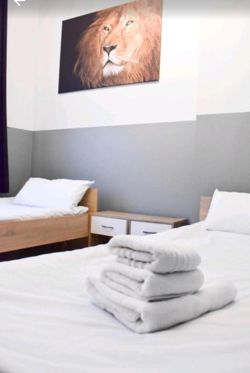 a bedroom with two beds with white towels on the bed at Apartment Bremerhaven in Bremerhaven