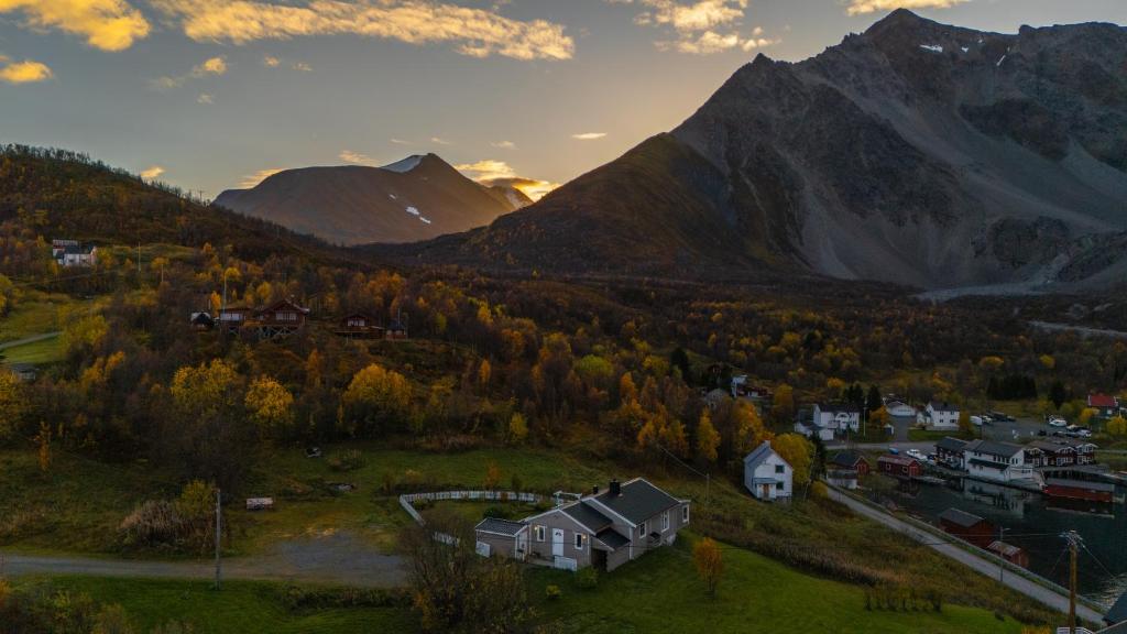 a village in a valley with mountains in the background at Stay where the mountains begin in Koppangen