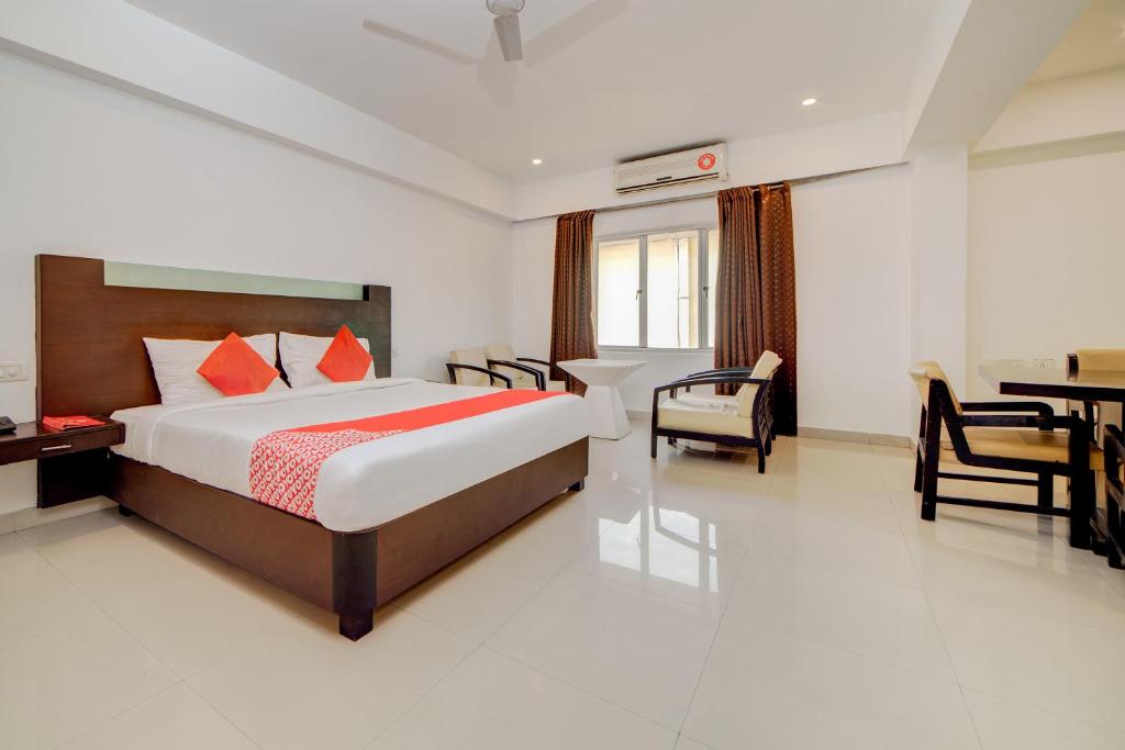 Postel nebo postele na pokoji v ubytování Hotel O Kachiguda Railway Station