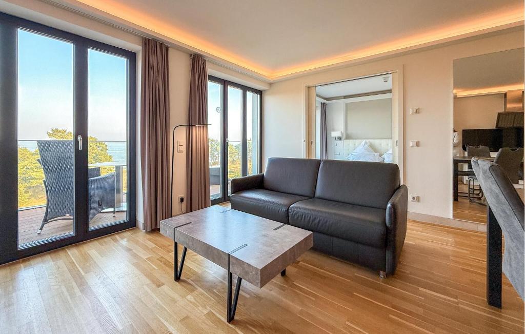 a living room with a couch and a table at Prince in Binz