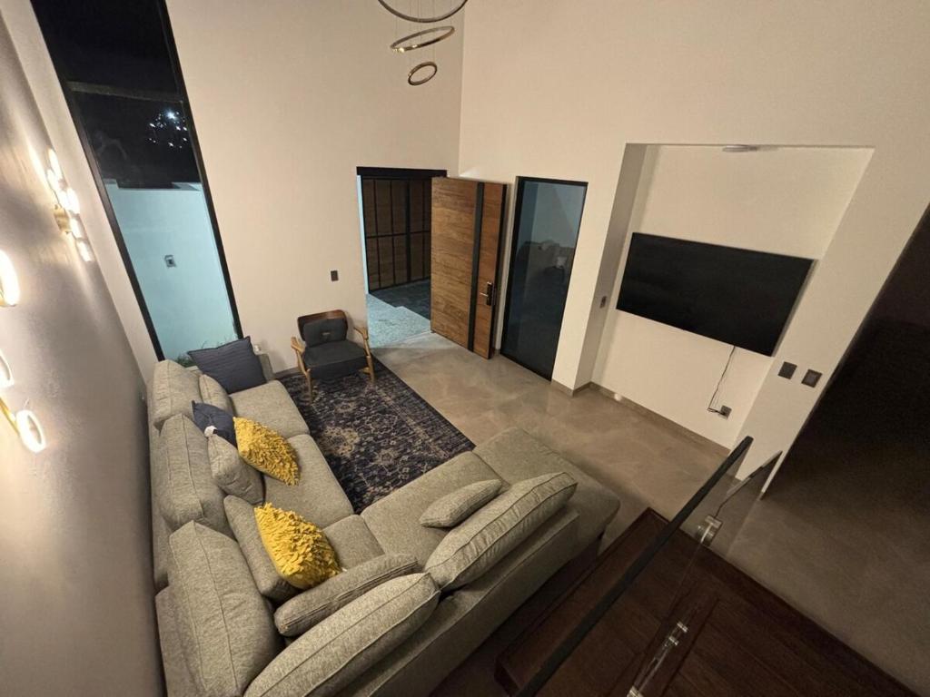 a view of a living room with a couch at New modern house in Qro in El Pueblito