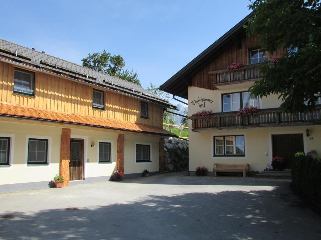 a building with a bench in front of it at Ferienwohnungen Maderebner in Gröbming