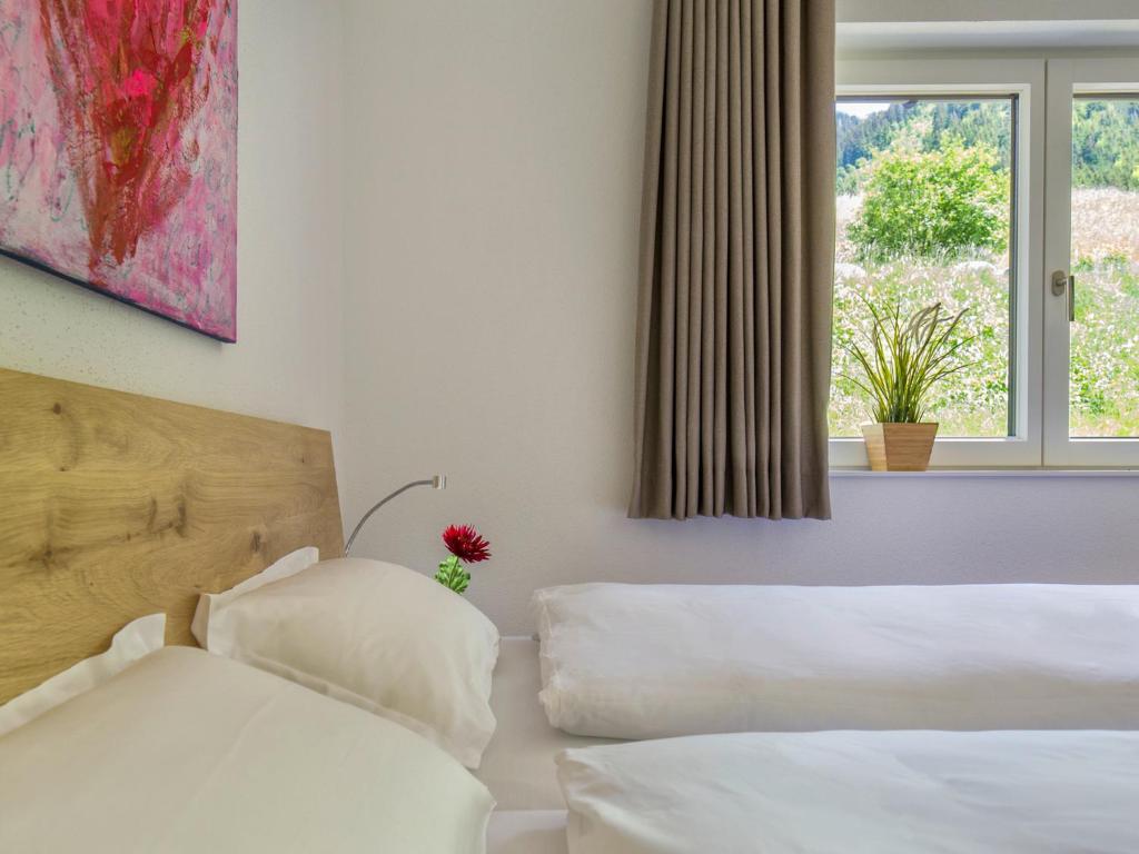 Voodi või voodid majutusasutuse Walser Lodge toas