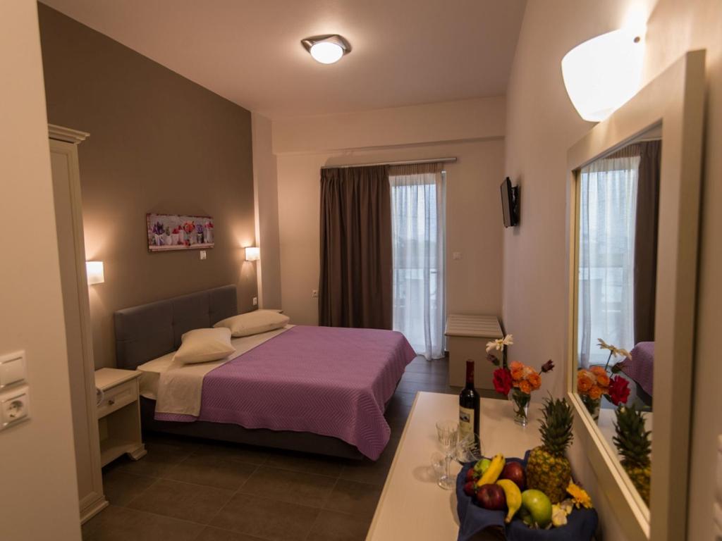Postel nebo postele na pokoji v ubytování Harmony Hotel