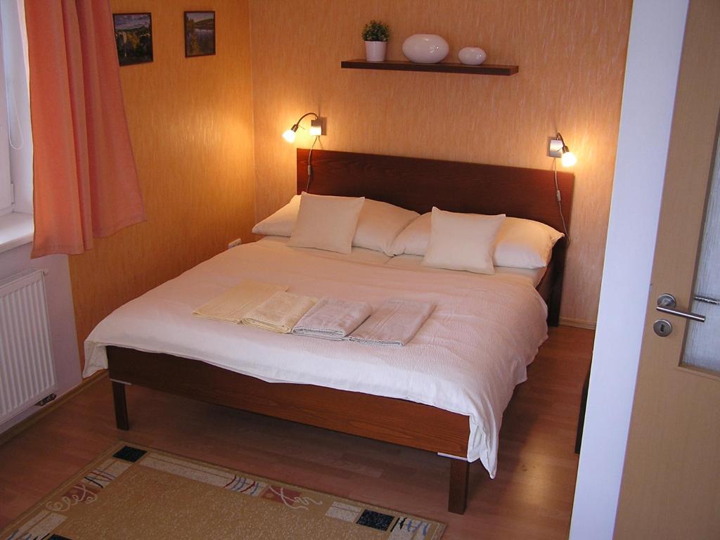 Postel nebo postele na pokoji v ubytování Gonda Apartments